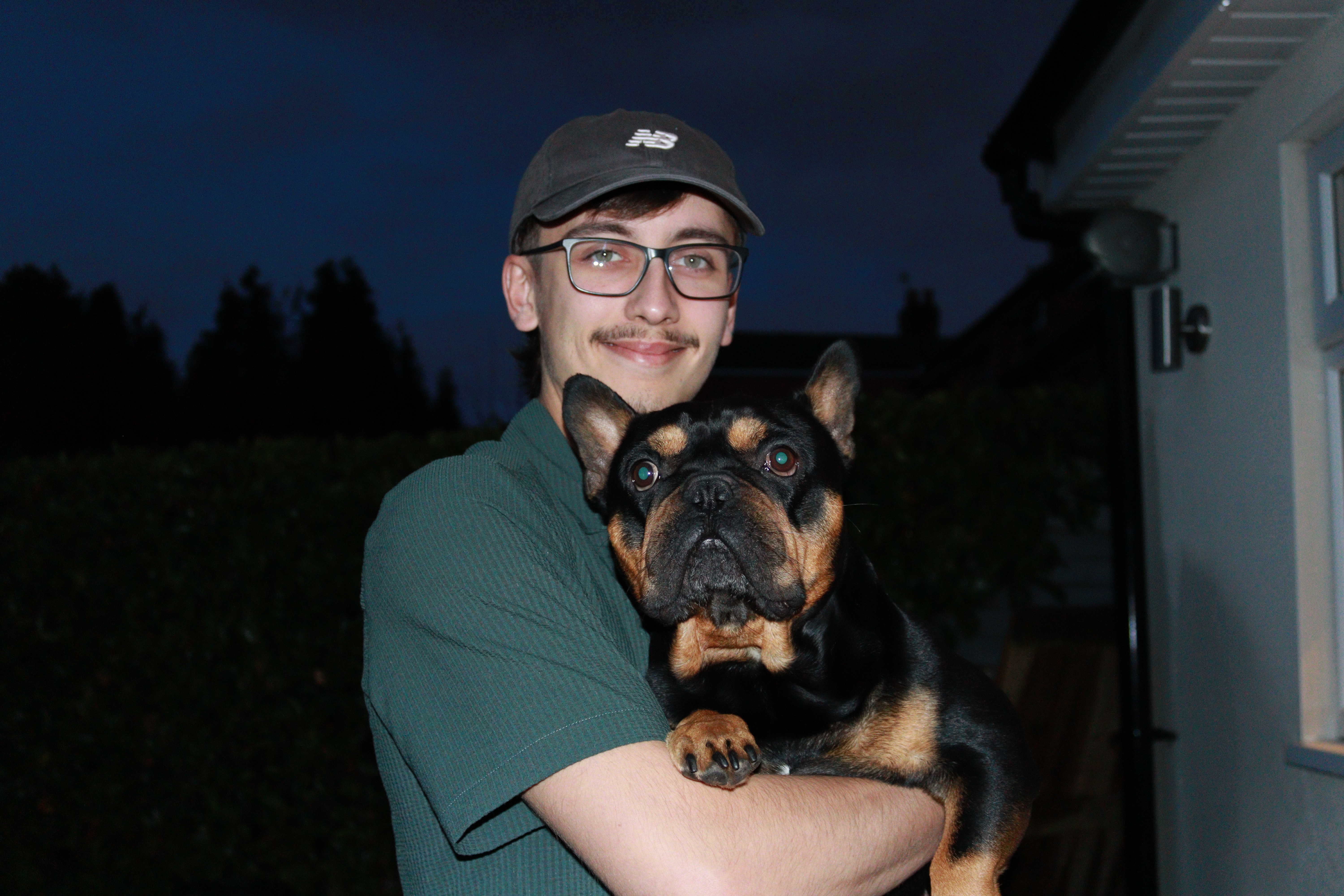 Jack Longmore holding his dog